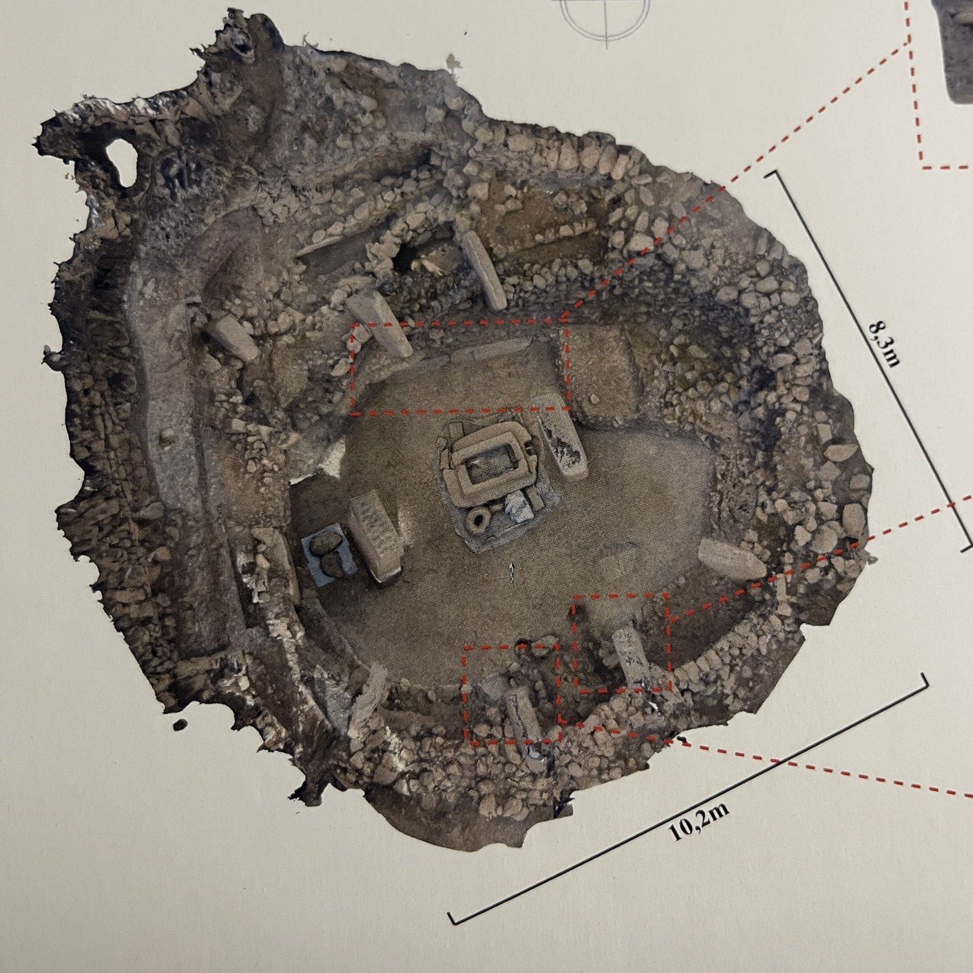 Vertical photogrammetry (orthographic model) of Enclosure B at Göbekli Tepe seen from directly above — the oval ring wall with T-pillars around the central pair and a porthole feature, with 10.2 m and 8.3 m scale bars