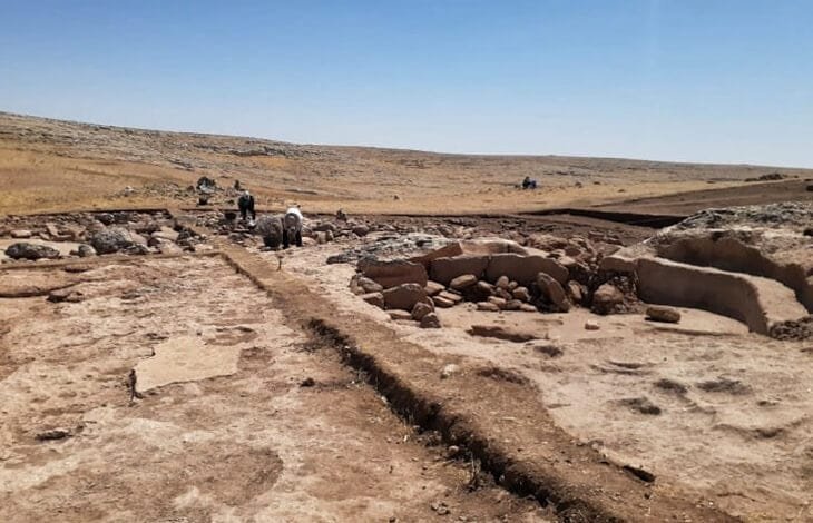 Harbetsuvan Tepesi under excavation — exposed drystone walling on the small Pre-Pottery Neolithic B mound that the Japanese-led survey mapped in full.