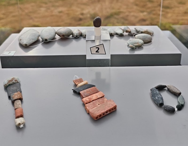 Beads recovered at Sefertepe — several shaped as snake heads, others incised with geometric patterns. Some were carved from jade and labradorite, stones not local to this geology.